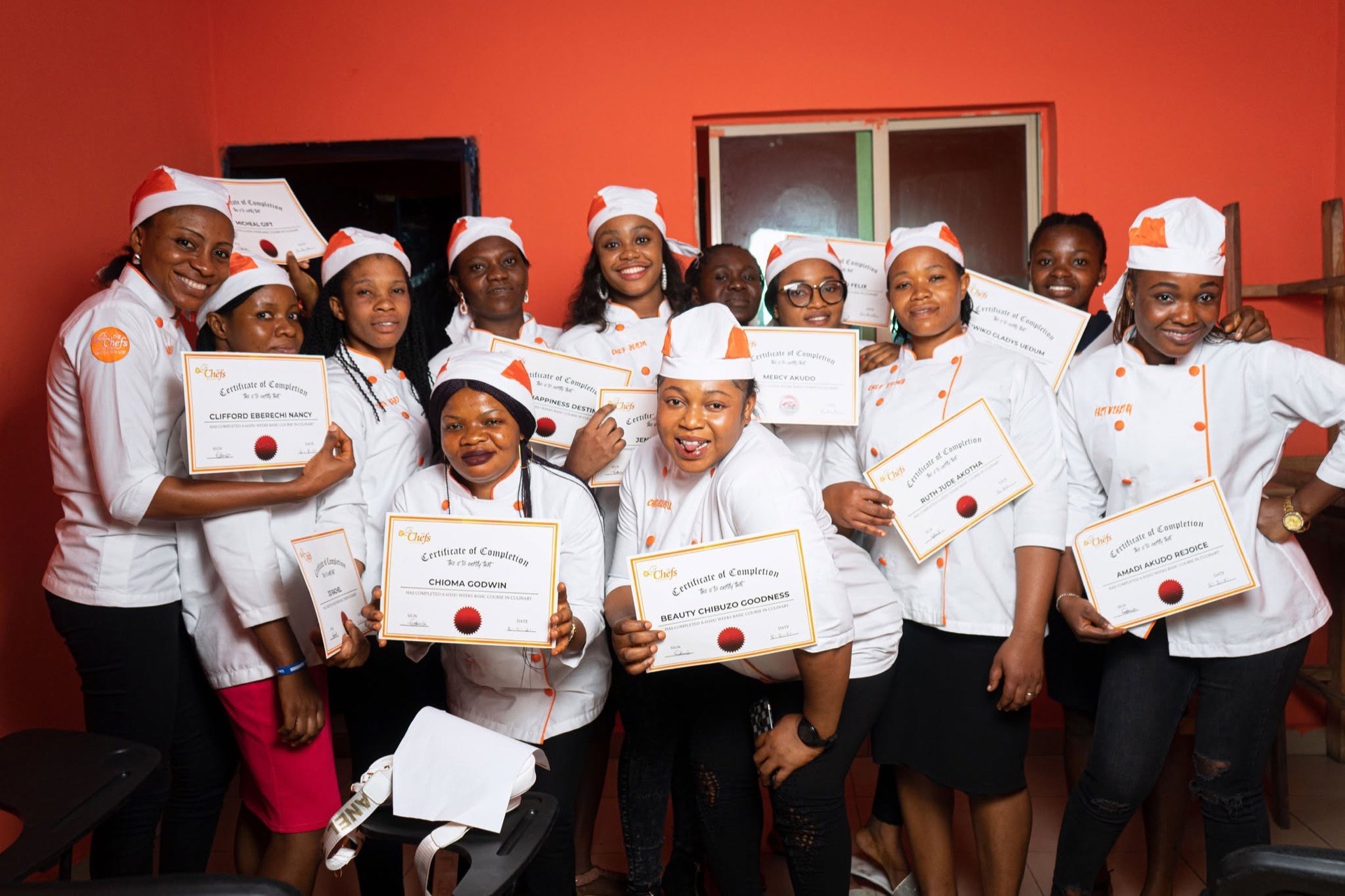 Graduates celebrating with their certificates